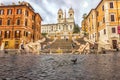 Piazza di Spagna, the Spanish Steps, TrinitÃÂ  dei Monti church and Fontana della Barcaccia or Fountain of the longboat Royalty Free Stock Photo